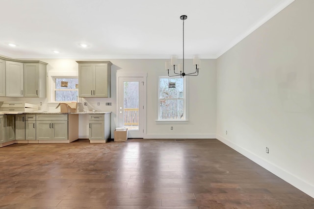 kitchen featuring a chandelier, recessed lighting, wood finished floors, baseboards, and crown molding