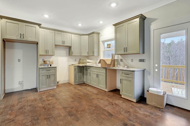 kitchen with dark wood-style floors, light stone counters, and recessed lighting