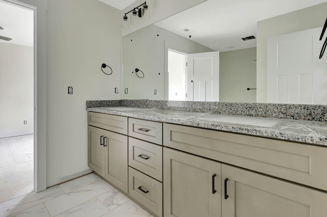 full bath featuring marble finish floor, visible vents, and vanity