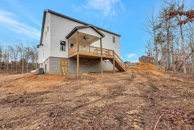 rear view of property featuring ceiling fan, a deck, central AC unit, and stairs