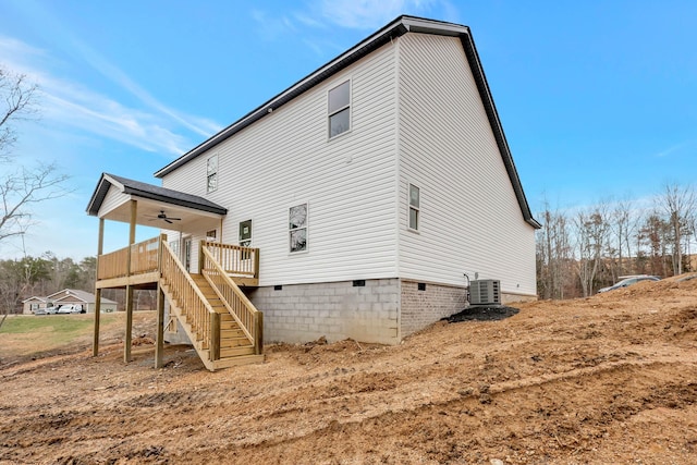 rear view of house with central AC unit, a ceiling fan, stairs, crawl space, and a wooden deck