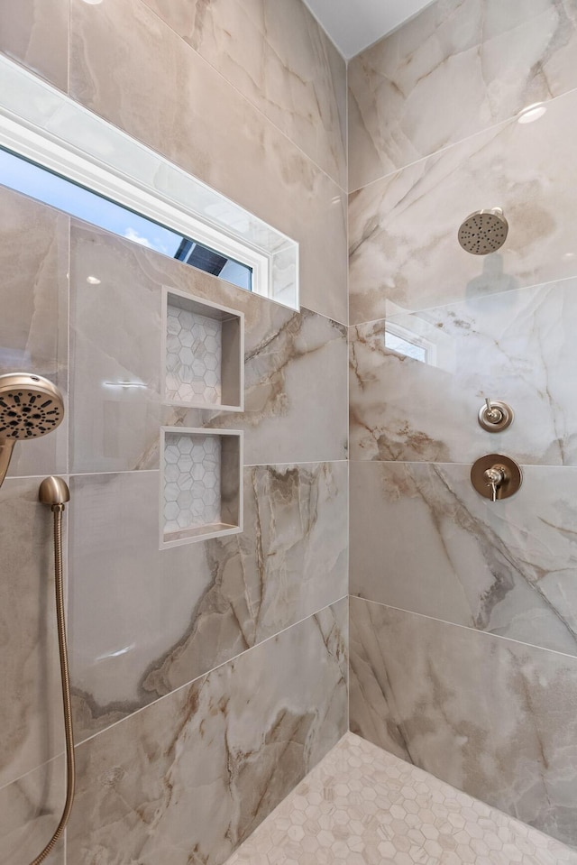 full bathroom with a tile shower