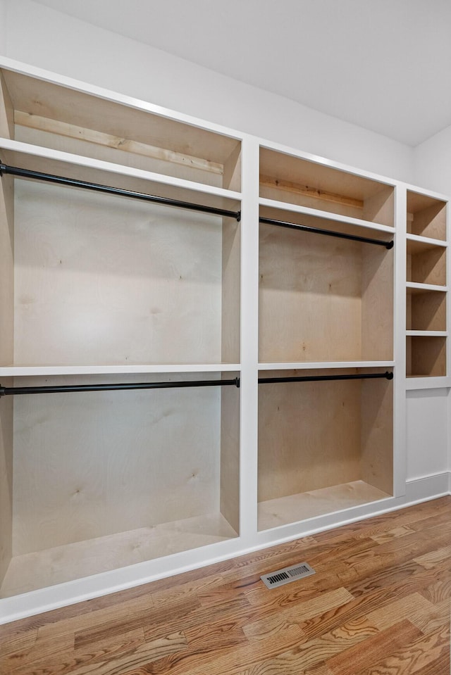 interior space featuring visible vents and wood finished floors