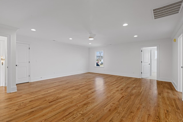 unfurnished room with light wood finished floors, visible vents, and recessed lighting