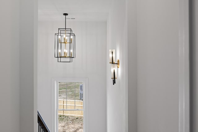 details featuring an inviting chandelier and visible vents