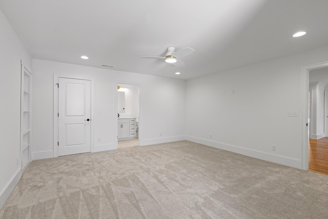 unfurnished bedroom featuring light carpet, baseboards, visible vents, and recessed lighting