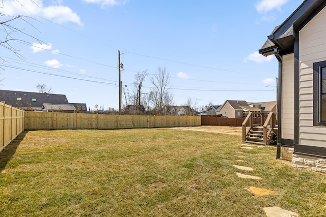 view of yard with a fenced backyard