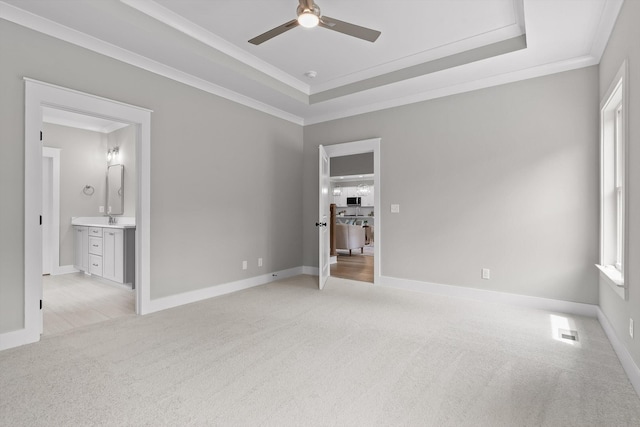 5118 Judd Way NW Unit 21, Cleveland, TN 37312 - unfurnished bedroom with light colored carpet, ornamental molding, a tray ceiling, connected bathroom, and a ceiling fan