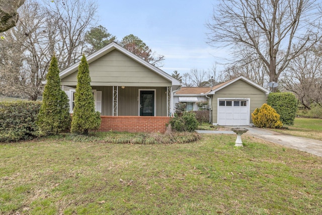 bungalow with a front lawn, concrete driveway, and brick siding