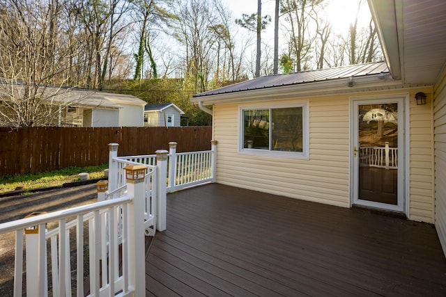 wooden terrace featuring fence