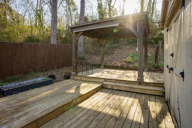 deck with a gazebo and fence