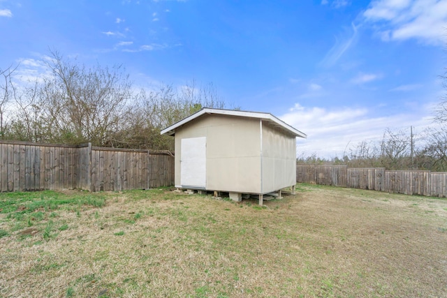 view of shed with a fenced backyard