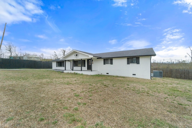 view of front of home with brick siding, fence, a front yard, central AC unit, and crawl space