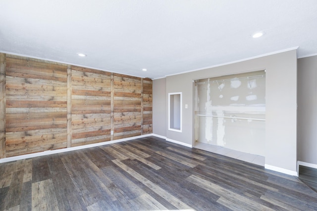 unfurnished room with visible vents, ornamental molding, wood finished floors, recessed lighting, and baseboards