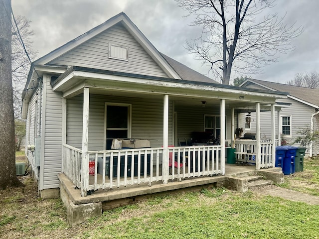 view of front of home with covered porch and central air condition unit