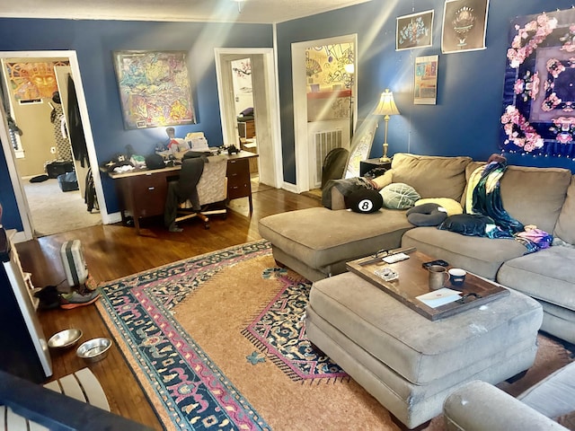 living room with baseboards and wood finished floors