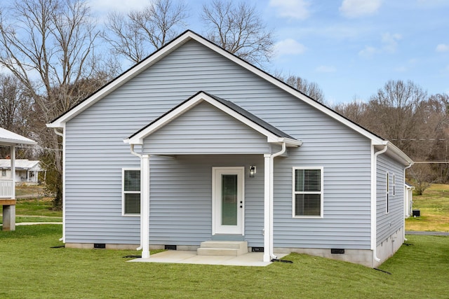 exterior space with entry steps, crawl space, and a yard