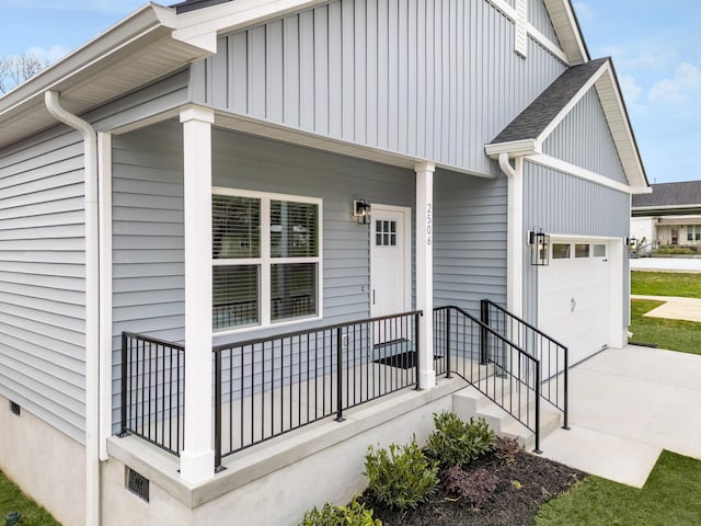 view of front of house featuring an attached garage, driveway, a porch, and a shingled roof