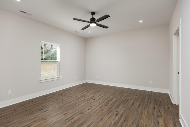 empty room featuring baseboards, visible vents, a ceiling fan, dark wood-style flooring, and recessed lighting