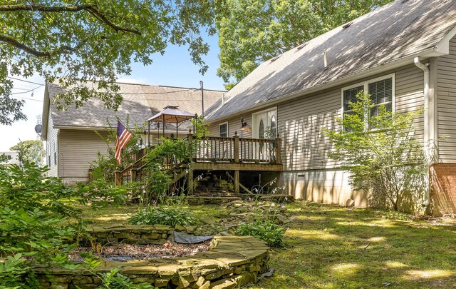 view of yard with stairway and a wooden deck