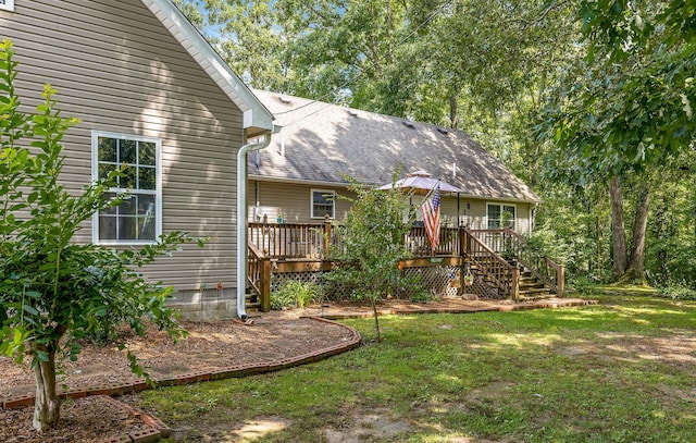 view of yard with a deck and stairway