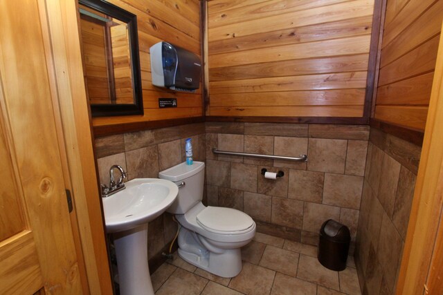 bathroom with toilet and tile patterned floors