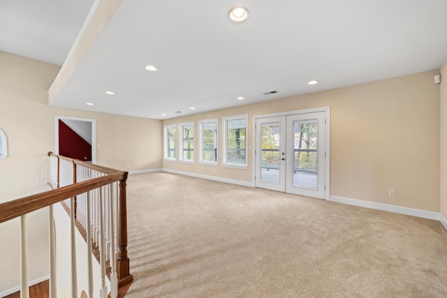 unfurnished room featuring recessed lighting, visible vents, baseboards, french doors, and carpet