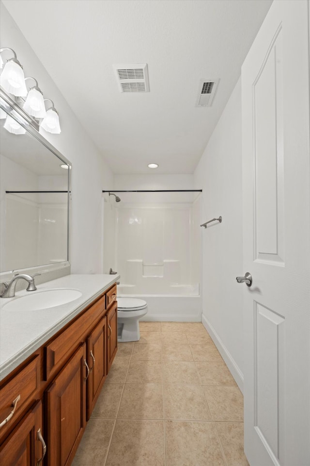 bathroom with toilet, vanity, visible vents, and tile patterned floors