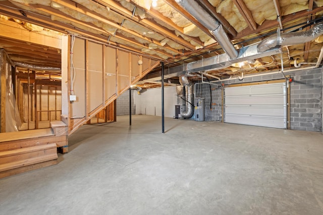 below grade area with water heater and a garage