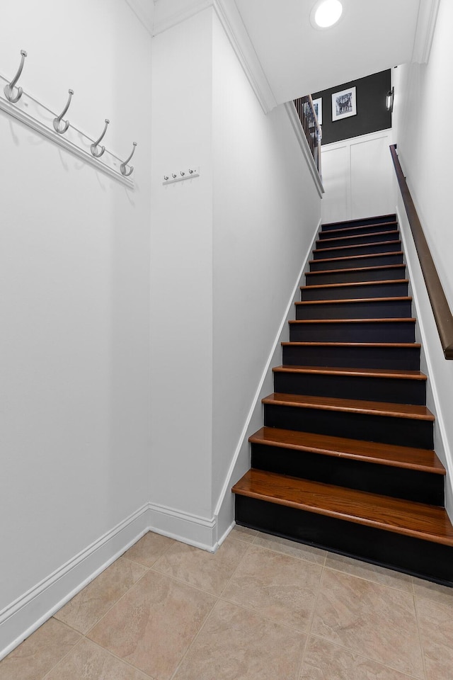 stairway featuring tile patterned floors, baseboards, and recessed lighting