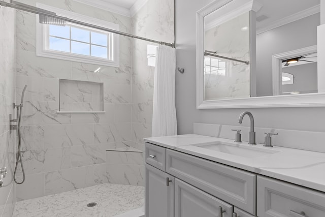 bathroom with vanity, a marble finish shower, and ornamental molding