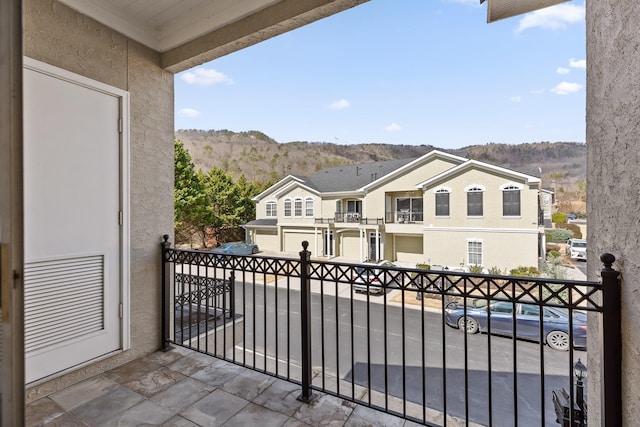 balcony featuring a mountain view and a residential view