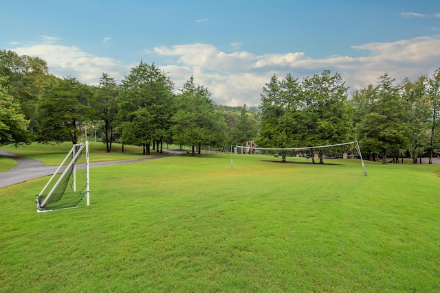 view of property's community featuring volleyball court