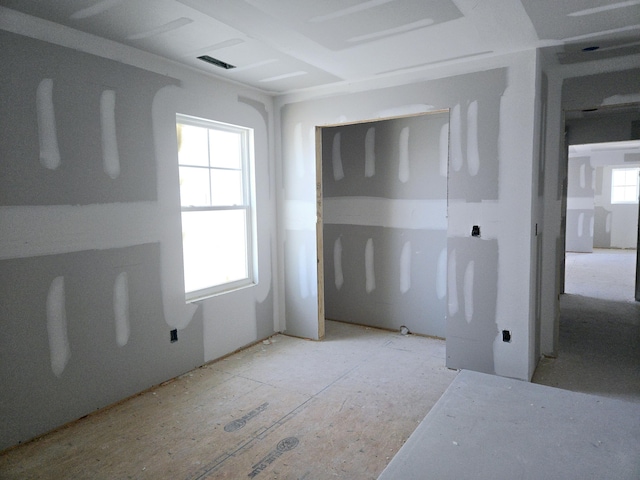 spare room featuring visible vents