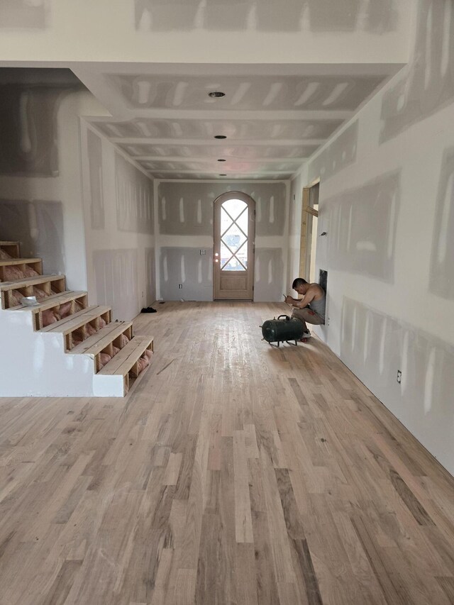 unfurnished living room featuring wood finished floors and a fireplace