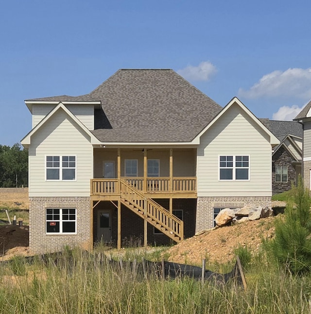 10634 Flicker Way Unit 119, Apison, TN 37302 - back of house featuring a shingled roof, brick siding, and stairway