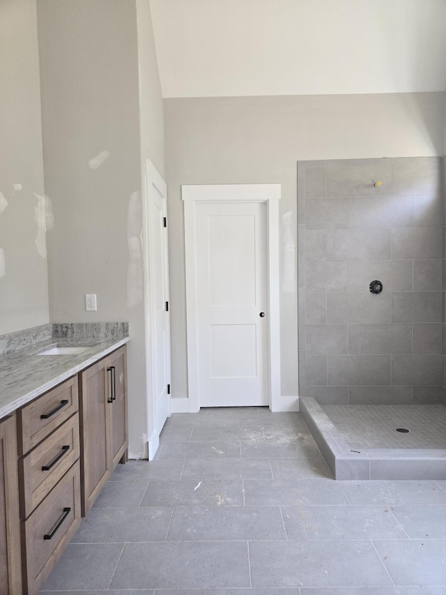 10634 Flicker Way Unit 119, Apison, TN 37302 - bathroom with vanity, tiled shower, and tile patterned flooring