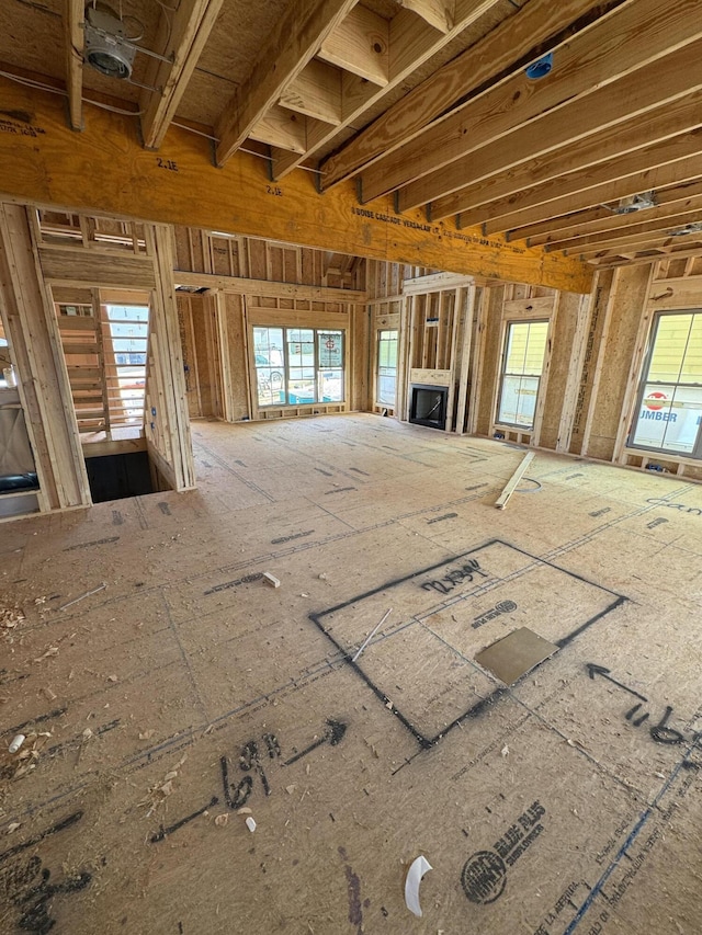 unfurnished living room featuring plenty of natural light