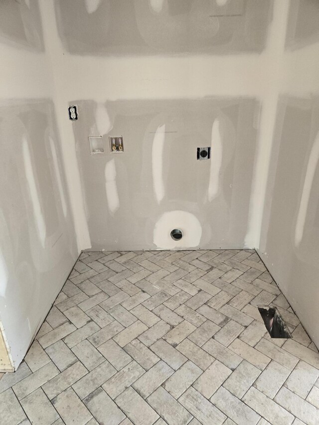 bathroom featuring brick floor