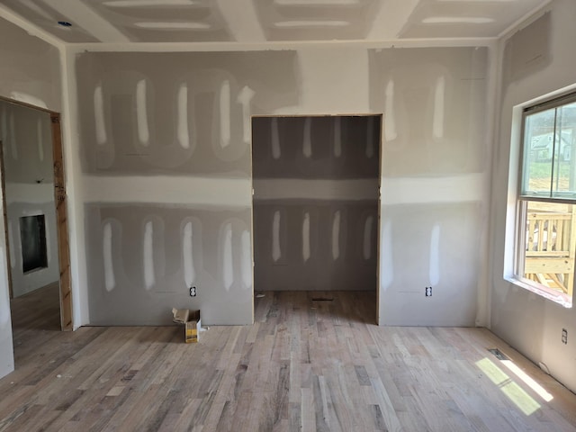 unfurnished living room with wood finished floors