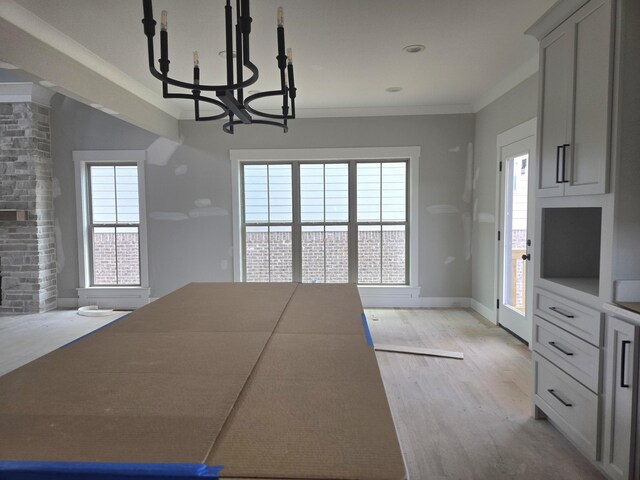 10630 Flicker Way Unit 120, Apison, TN 37302 - unfurnished dining area featuring a chandelier, light wood finished floors, and ornamental molding