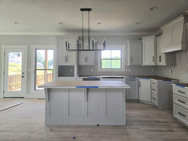 10630 Flicker Way Unit 120, Apison, TN 37302 - kitchen featuring a kitchen island, decorative light fixtures, ornamental molding, light wood-style floors, and recessed lighting