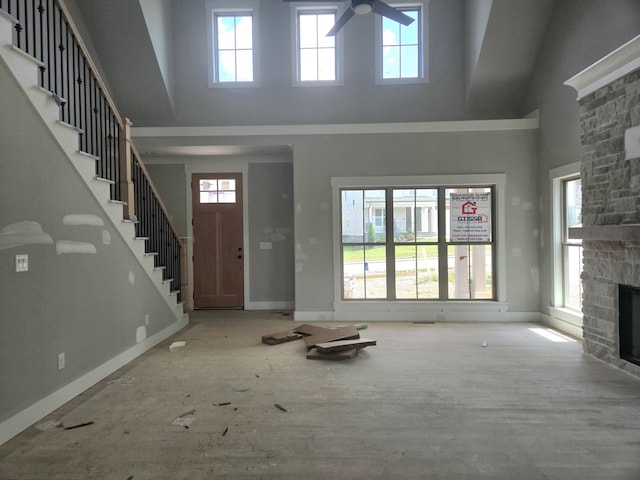 10630 Flicker Way Unit 120, Apison, TN 37302 - entrance foyer with a high ceiling, plenty of natural light, a stone fireplace, ceiling fan, and stairway