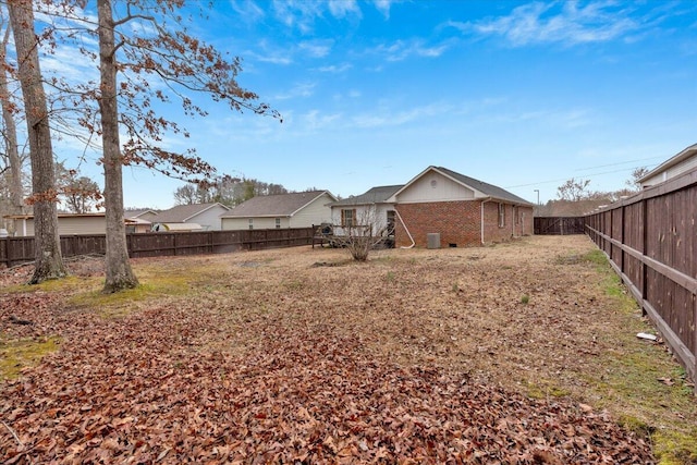 view of yard with a fenced backyard