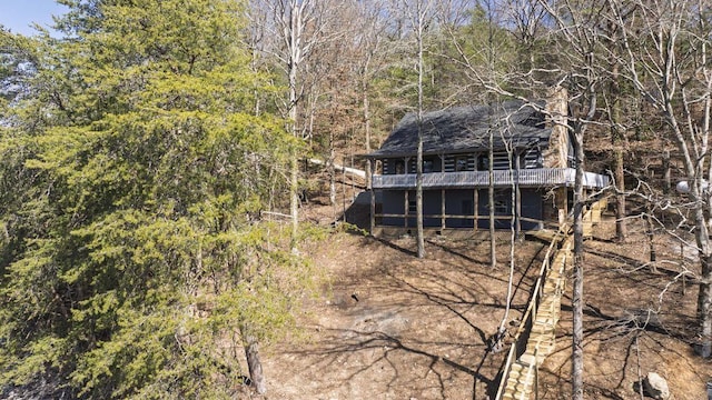 exterior space with a wooded view