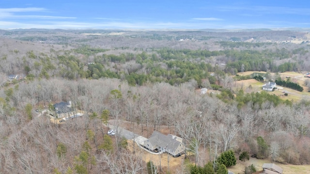 drone / aerial view featuring a view of trees