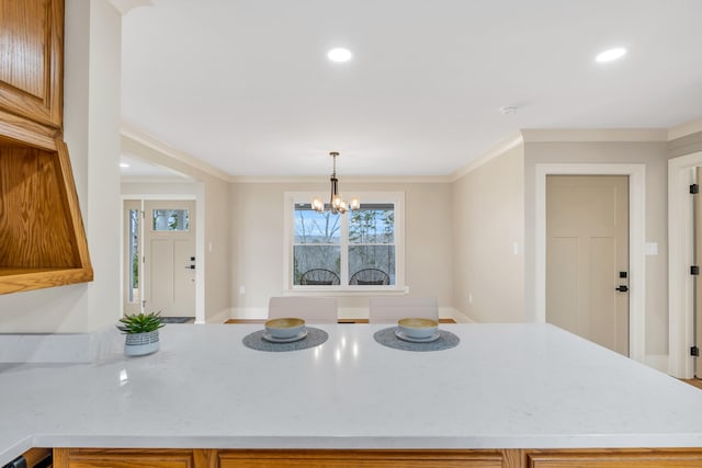 kitchen with recessed lighting, a chandelier, crown molding, and decorative light fixtures