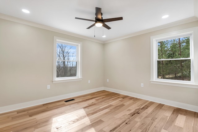 empty room featuring recessed lighting, baseboards, visible vents, and light wood finished floors