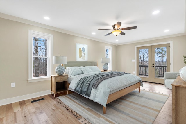 bedroom with light wood-style flooring, visible vents, baseboards, access to exterior, and french doors