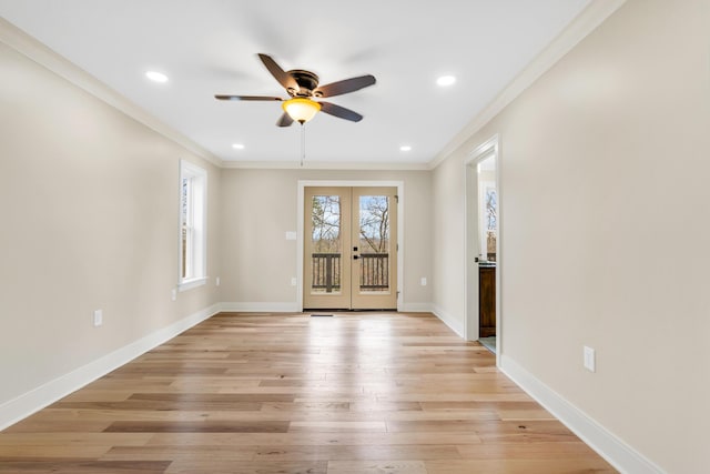 spare room featuring french doors, recessed lighting, light wood-style floors, ornamental molding, and baseboards